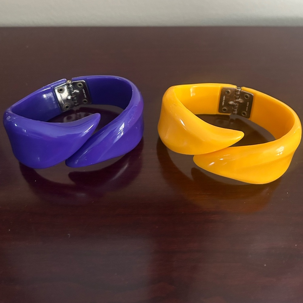 2 Vintage 1970’s lucite clamper hinged bracelets signed. Made in Hong Kong.